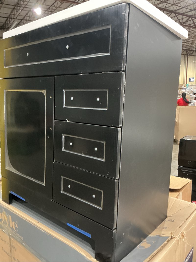 Condition photo showing As Is for  style selections cauley 30-in black single sink bathroom vanity with white cultured marble top