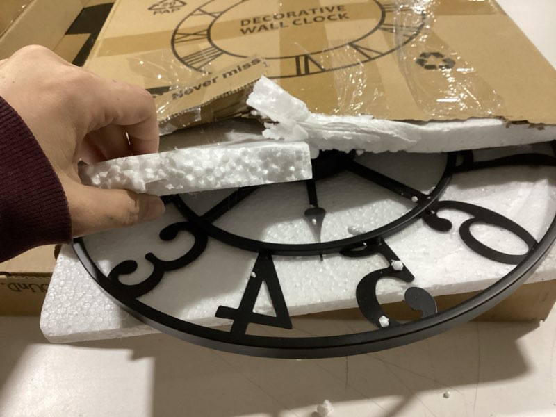 Condition photo showing As Is for LEIKE Large Wall Clocks,Silent,Non Ticking,Battery Operated Rustic Round Modern Big Metal Wall Clock for Living Room, Bedroom,Kitchen,Farmhouse,Office,Home Decor-16 Inch(Black-Arabic Number) 16 IN Black Metal-arabic Number