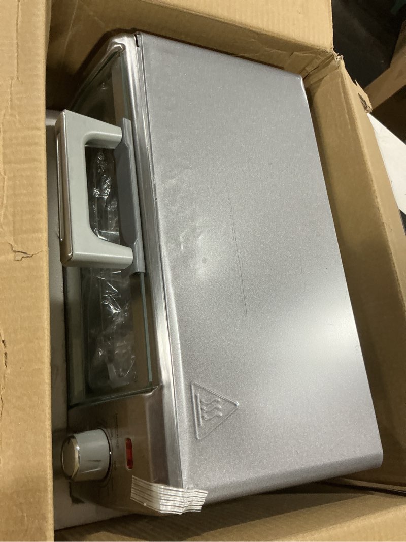 Condition photo showing As Is for BLACK+DECKER Crisp ‘N Bake Air Fry 4-Slice Toaster Oven  Silver & Black  Fits 9 Inch Pizza  .35 Cubic Feet