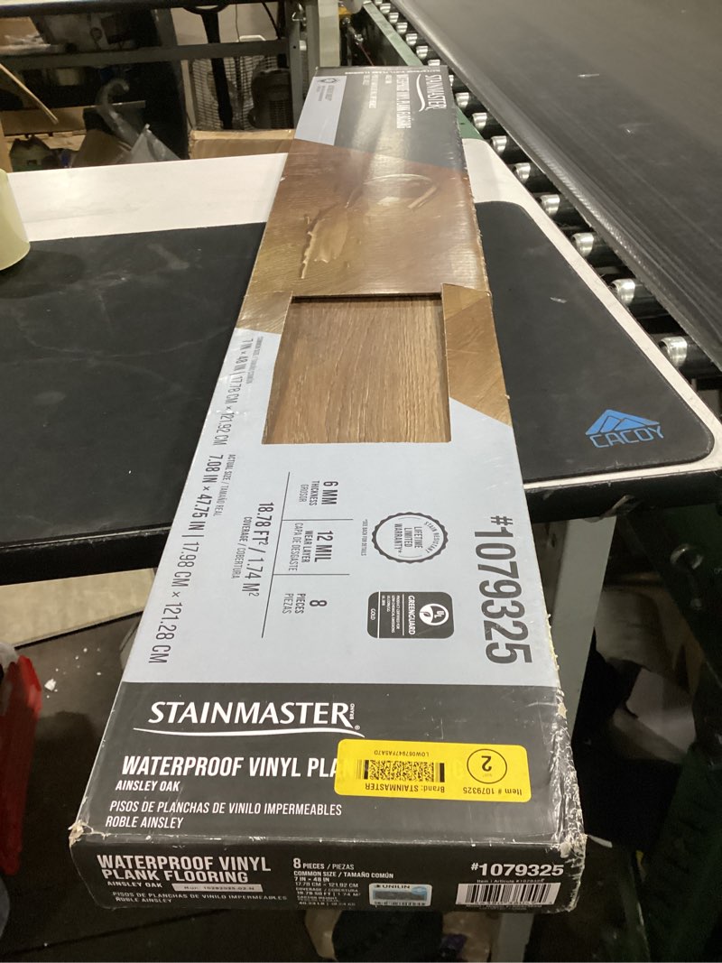 Condition photo showing New/Like New for stainmaster ainsley brown 12-mil x 7-in w x 48-in l waterproof interlocking luxury vinyl plank flooring (18.78-sq ft/ carton)