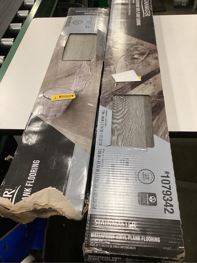 Condition photo showing As Is for Assorted STAINMASTER PetProtect Nayatt Point Hickory mm Waterproof Laminate Wood Flooring