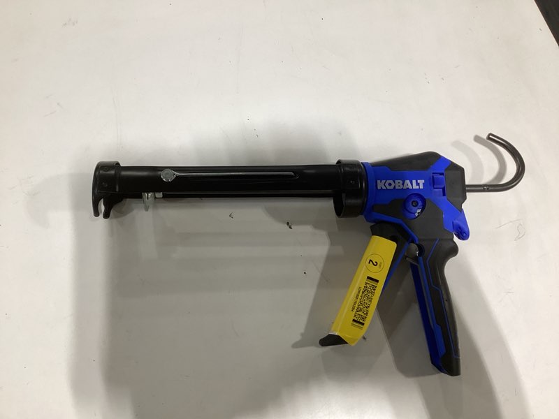 Condition photo showing As Is for kobalt dual thrust 10 -oz anti-drip smooth rod caulk gun