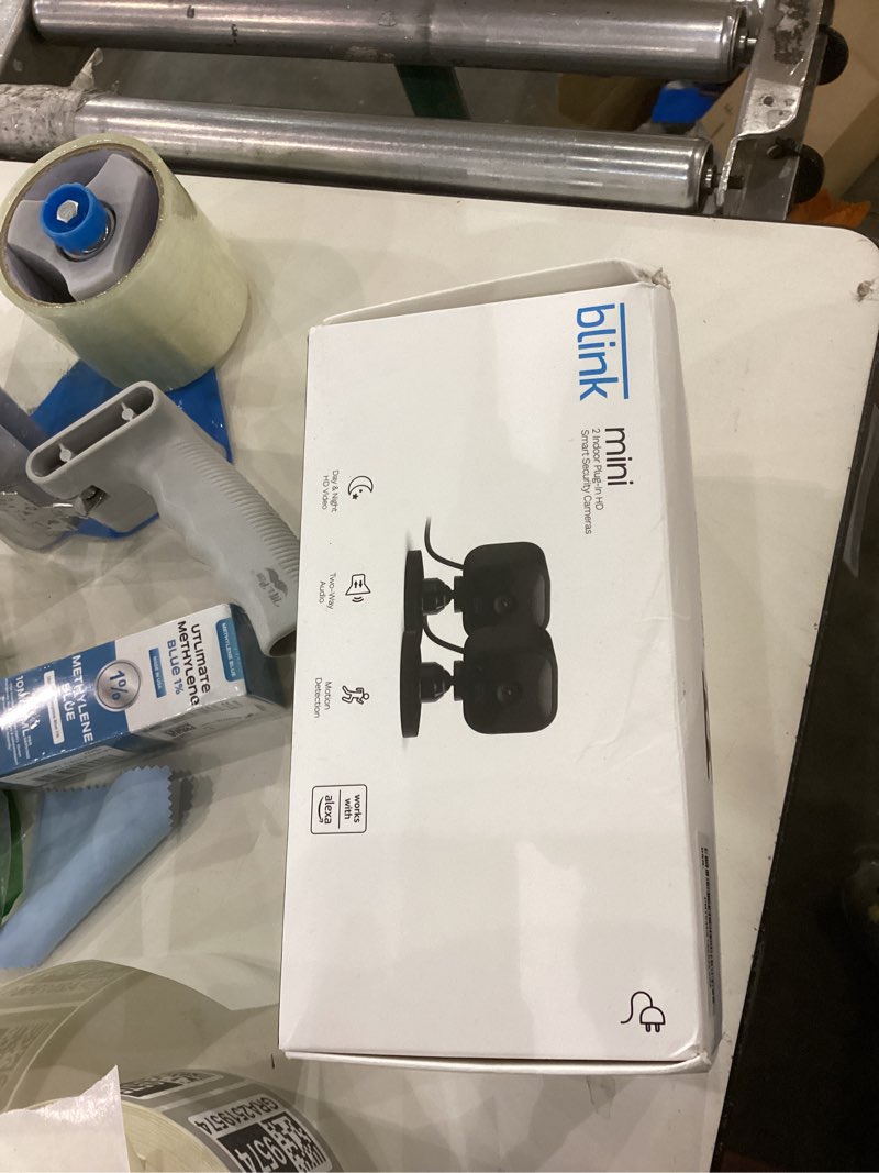 Condition photo showing New/Like New for Blink Mini - Compact indoor plug-in smart security camera, 1080p HD video, night vision, motion detection, two-way audio, easy set up, Works with Alexa – 2 cameras (Black) 2 Cameras Black