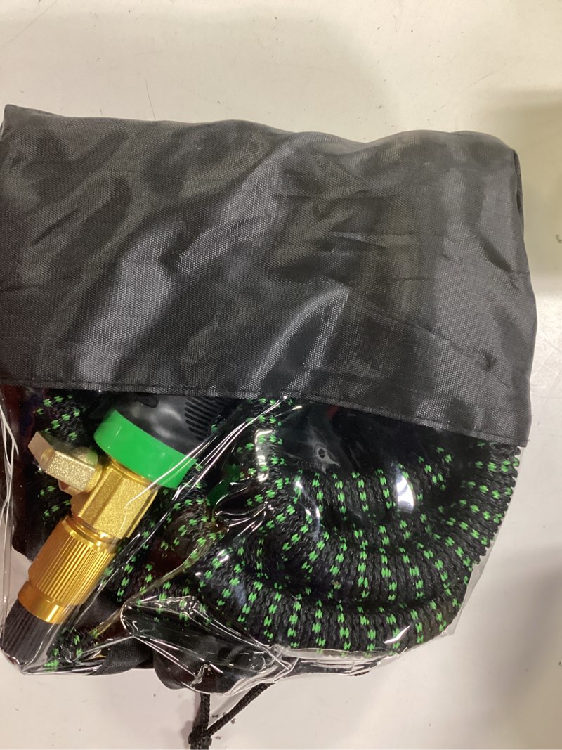 Condition photo showing As Is for non-expandable garden hose, flexible ultra lightweight durable, kink-free water hose with 10 function sprayer - non-tangle,puncture proof pipe, easy to store, all-weather use garden hoses blackgreen 75ft