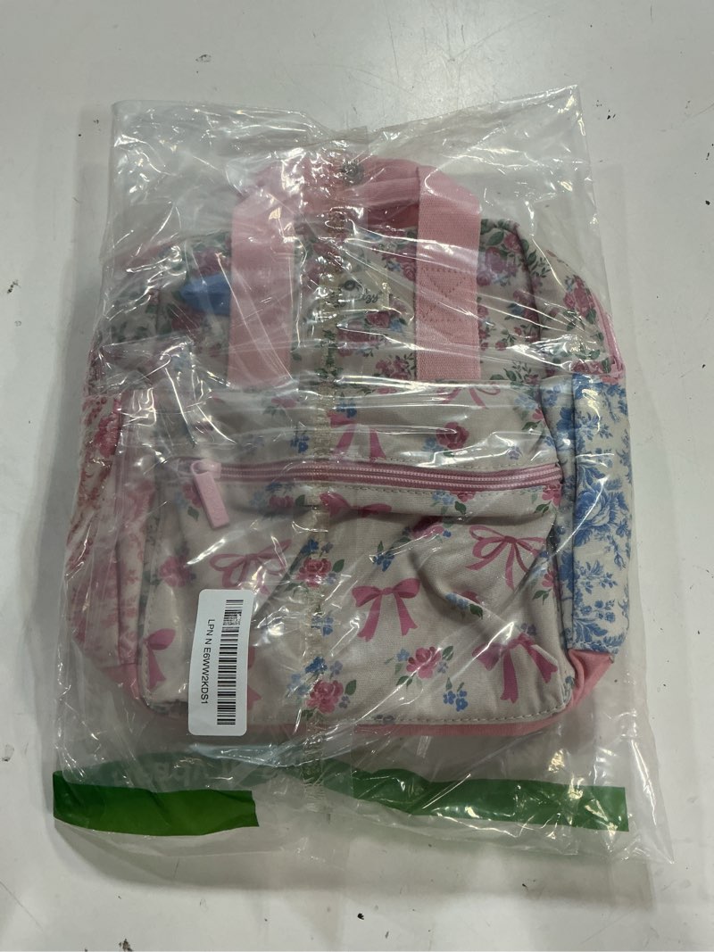 Condition photo showing New/Like New for itzy ritzy toddler backpack - daycare bag - features adjustable shoulder straps, 2 side pockets & spacious interior with wipeable fabric lining & name label, ribbons & roses backpack small ribbons