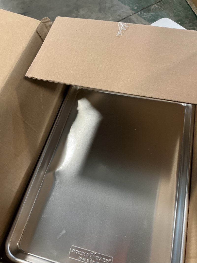 Condition photo showing As Is for nordic ware naturals half sheet - usa made aluminum commercial quality sheet pan for baking or roasting, encapsulated galvanized steel rim prevents warping, 2-pack 2pk half sheet
