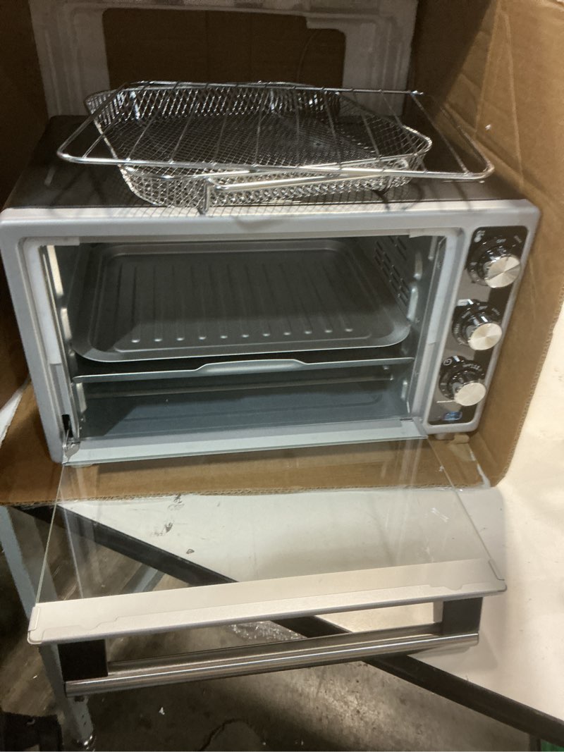 Condition photo showing Good Condition for Amazon Basics 6-Slice 23-QT Toaster Oven with Built-In Air Fryer, 7-In-1 Cooking Options, 60-Min Timer & Adjustable Temperature (200? - 450?), With Accessories, 1500W, Stainless Steel, Silver/Gray