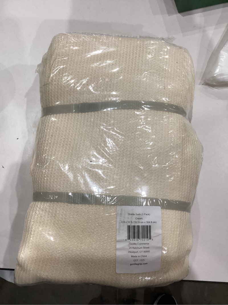 Condition photo showing As Is for GORILLA GRIP Heavy Duty Sun Shade, UV Protection Fade Tear and Rust Resistant Rectangle Sunshade Canopy, Curved Edges Blocks Sunlight, Breathable Sail, Outdoor Patio, Lawn Garden, 6x10 FT Butter Cream 6' x 10' Rectangle Butter Cream