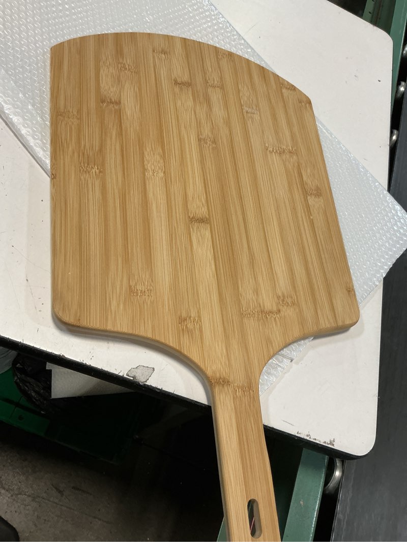 Condition photo showing As Is for pizza peel 14 inch?16" l x 14" w plate, with 8" l wooden handle, 24" overall length?wooden pizza peel.14 in pizza peels (large) 24"l x 14"w