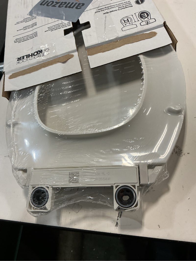 Condition photo showing As Is for KOHLER 4636-RL-0 Cachet ReadyLatch Elongated Toilet Seat Slow Close, Soft Close Toilet Seat Quiet Lid, Contoured Grip-Tight Bumpers Installation Hardware, Apartment Essentials, White White Elongated Ready Latch