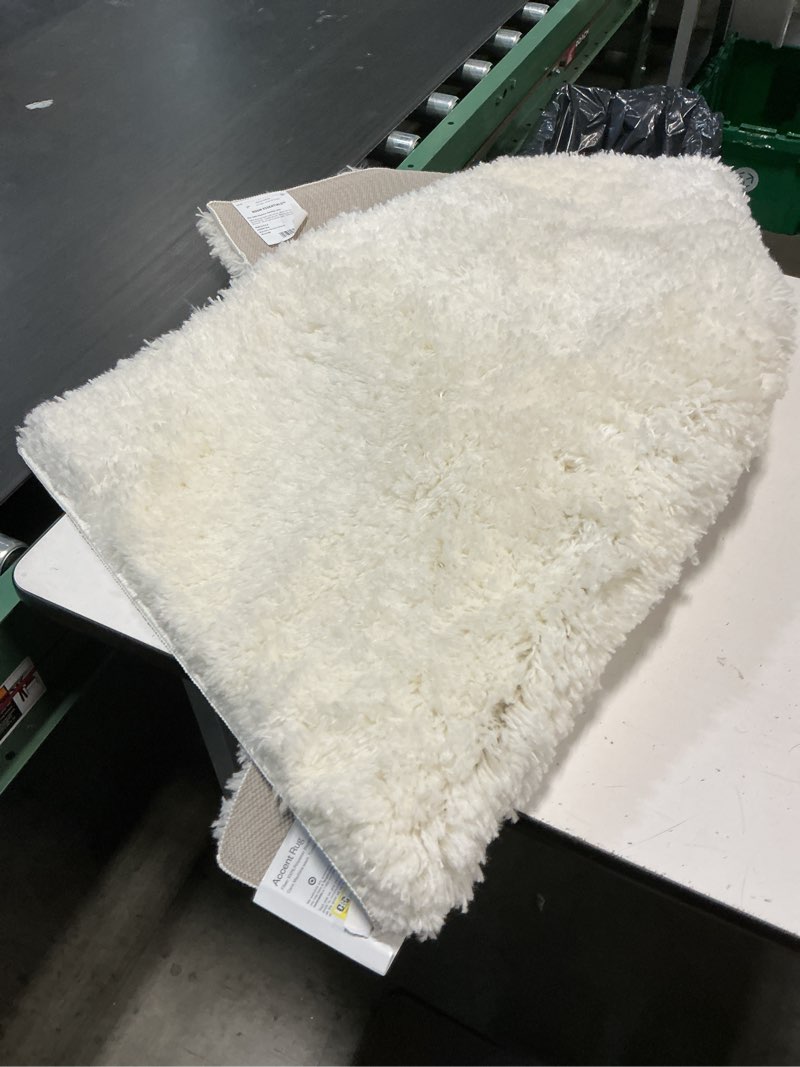 Condition photo showing As Is for 2'6"x3'10" washable plush shag accent rug cream - room essentials™: high pile, skid & stain resistant, indoor use