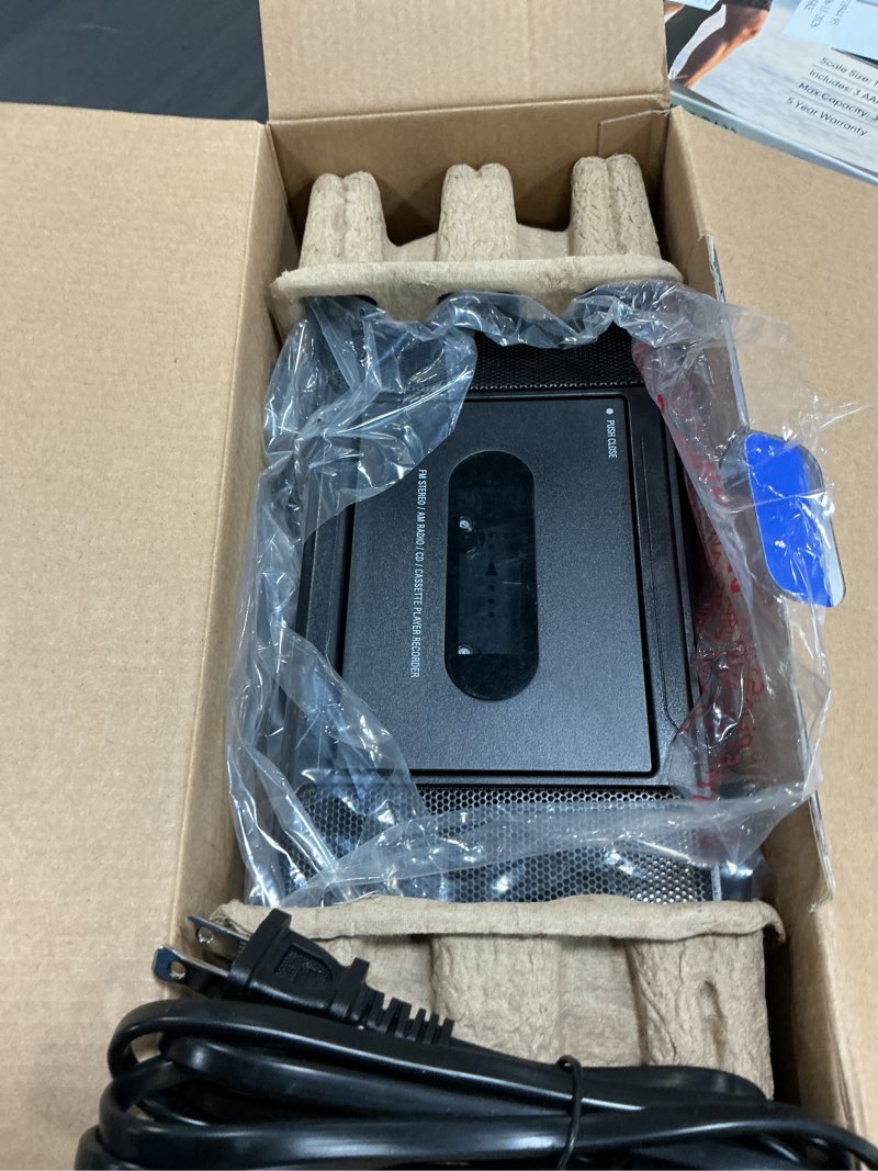 Condition photo showing As Is for onn. portable bluetooth cd/cassette boombox with am/fm radio, black