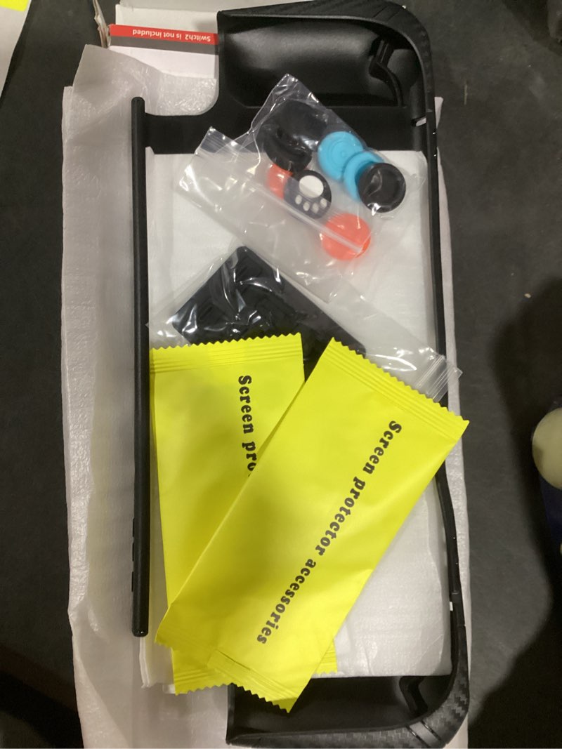 Condition photo showing New/Like New for Case Set for Switch 2 Case, Switch 2 Grip Accessories, Includes 1 Protective Case with Clear PC Back and TPU Ergonomic Grip, 2 9H Tempered Glass Screen Protectors, 8 Joycon Caps, and 8 Dust Plugs