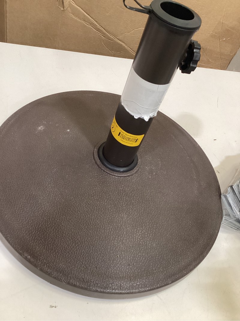 Condition photo showing As Is for style selections 22-lb brown hdpe plastic patio umbrella base
