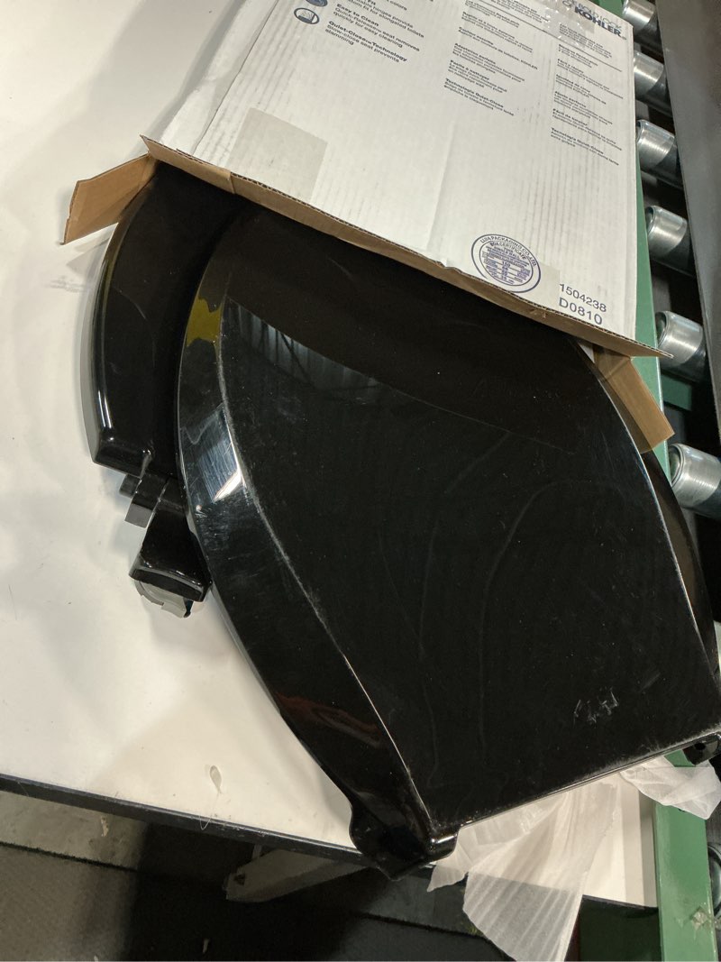Condition photo showing item condition for KOHLER 4636-RL-7 Cachet ReadyLatch Elongated Toilet Seat Slow Close, Soft Close Toilet Seat Quiet Lid, Contoured Grip-Tight Bumpers Installation Hardware, Apartment Essentials, Black Black Elongated Ready Latch
