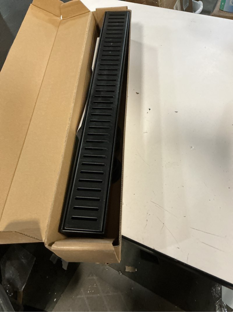 Condition photo showing Good Condition for WEBANG 24 Inch Linear Shower Drain Rectangular Floor Drain with Accessories Capsule Pattern Cover Grate Removable SUS304 Stainless Steel CUPC Certified Matte Black Matte Black 24 Inch
