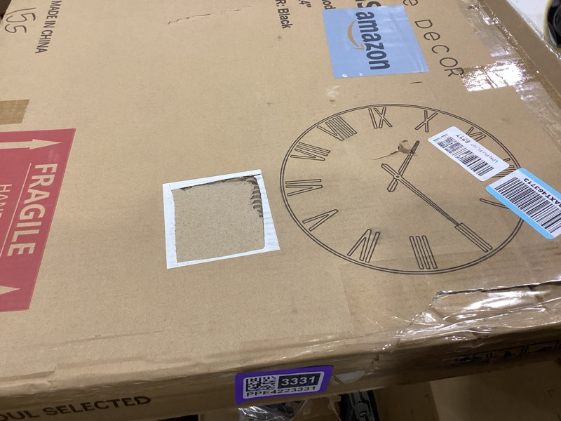 Condition photo showing Good Condition for large modern wall clock - 24 inch, contemporary simple, matte black, distressed gold roman numerals, metal face, battery operated, minimalist decorative wall clock for living room, entryway, kitchen black 24''