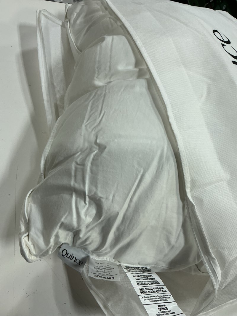 Condition photo showing As Is for quince premium down alternative pillow standard firm