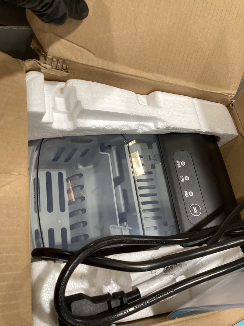 Condition photo showing As Is for EUHOMY Countertop Ice Maker Machine with Handle, 26lbs Per Day, 9 Ice Cubes Ready in 6 Mins, Auto-Cleaning Portable Ice Maker with Basket and Scoop, for Home/Kitchen/Camping/RV (Silver) ICE MACHINE 11.57"D x 11.42"W x 8.74"H Light Grey