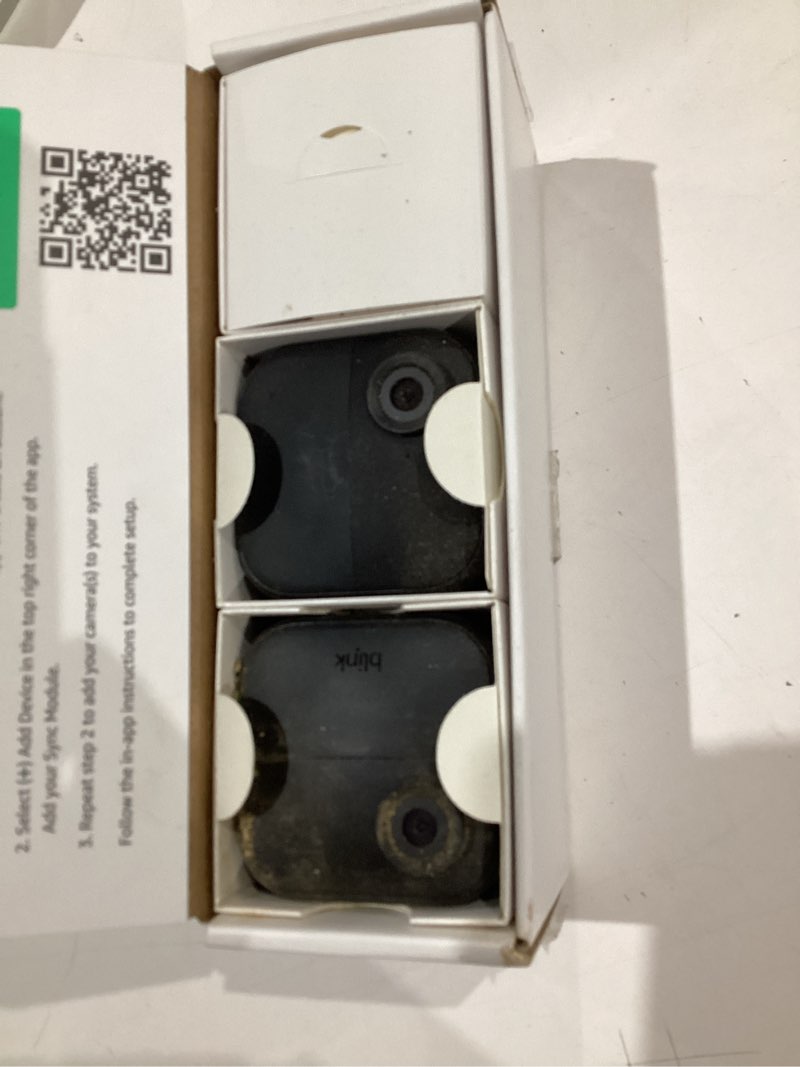 Condition photo showing As Is for blink outdoor 4 – wireless smart security camera, two-year battery life, 1080p hd day and infrared night live view, two-way talk. sync module core included – 2 camera system camera (2-year battery life) 2 camera system