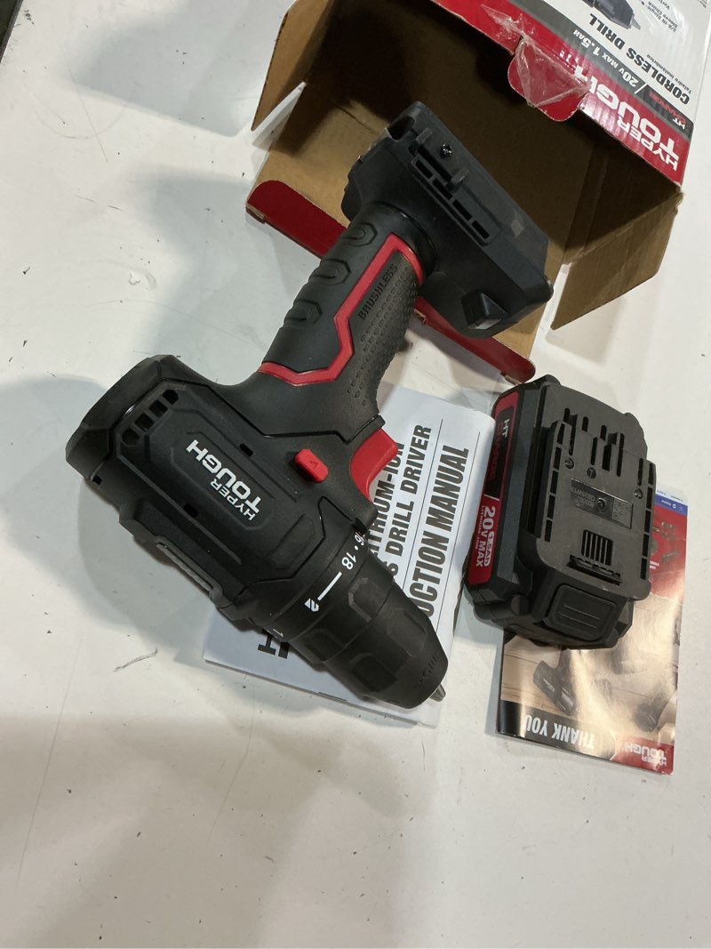 Condition photo showing As Is for hyper tough 20v max brushless cordless drill driver with 1.5ah lithium-ion battery and charger