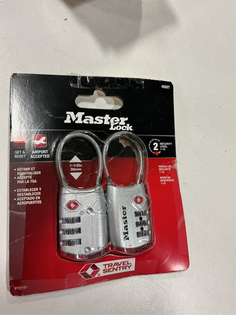 Condition photo showing As Is for Master Lock Padlock, Set Your Own Combination TSA Locks for Luggage, Travel Zipper Lock with Cable Shackle is 1-3/16 in. Wide, Colors May Vary, 4688T, 2 Count (Pack of 1) Assorted Colors 2 Pack