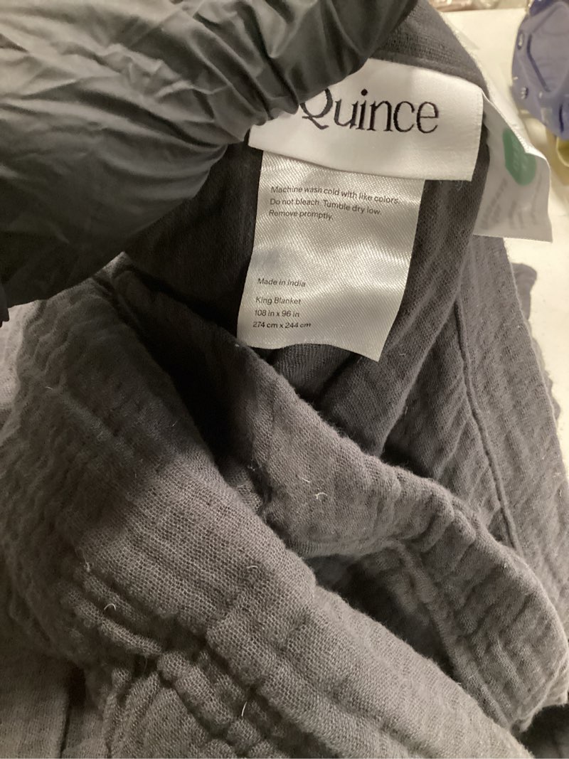 Condition photo showing As Is for organic airy gauze blanket, king/cal king, charcoal