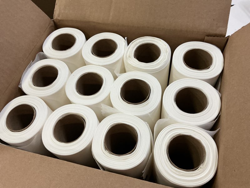 Condition photo showing New/Like New for caring headrest exam table paper, smooth, 8.5" x 225", 12 rolls/case, disposable medical table paper for chiropractors, massage therapists & physical therapy offices, hygienic surface protection