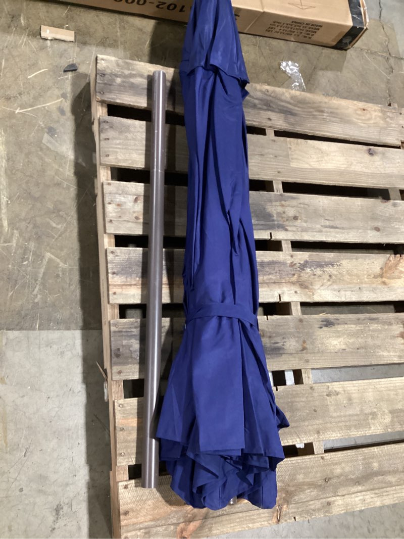 Condition photo showing As Is for commercial grade patio umbrella, 5-year fade resistant 260 gsm polyester canopy, rustproof aluminum frame, smooth tilt & crank for patio, restaurant, pool & deck - navy navy blue