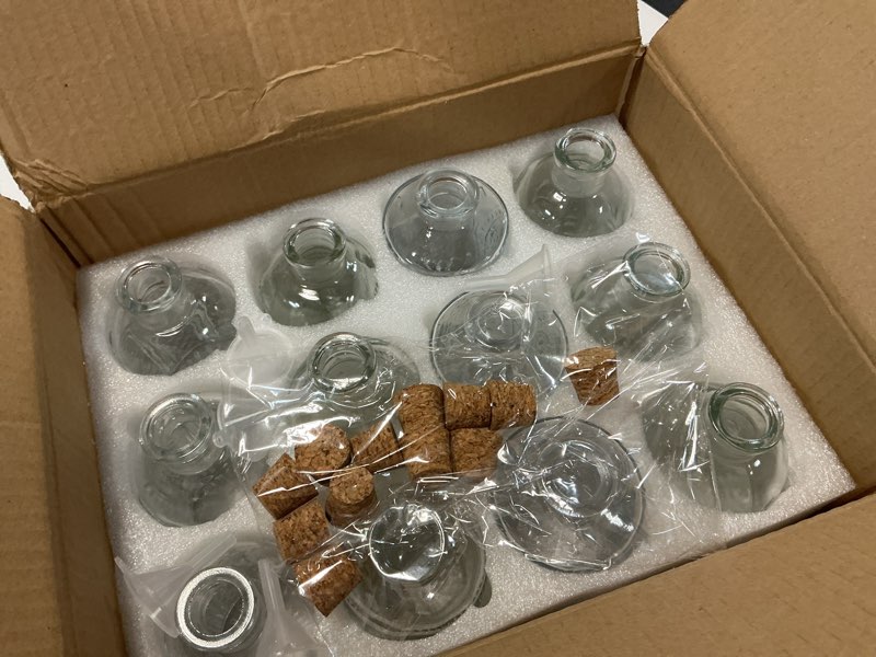Condition photo showing Good Condition for 12 pack 6oz glass bottles with cork stoppers, 200ml clear glass liquor bottles with 4 vintage patterns, refillable whiskey bottles for wine, oil, vinegar, kombucha, wedding favors clear 4 patterns