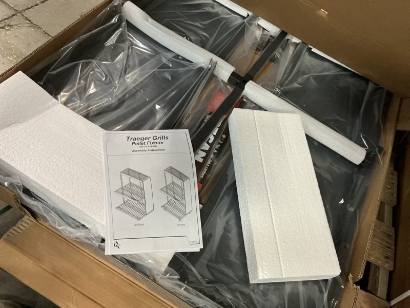 Condition photo showing As Is for (incomplete) (pick up only 2 box) traeger grills pellet fixture  pmt274 + pmt385