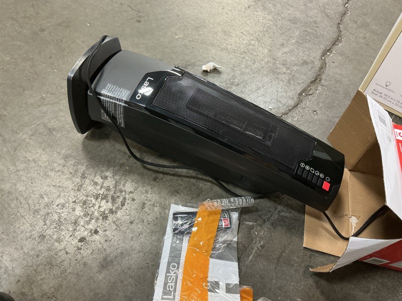 Condition photo showing As Is for Lasko 22  1500W Oscillating Ceramic Tower Space Heater with Remote  Black  CT22835  New