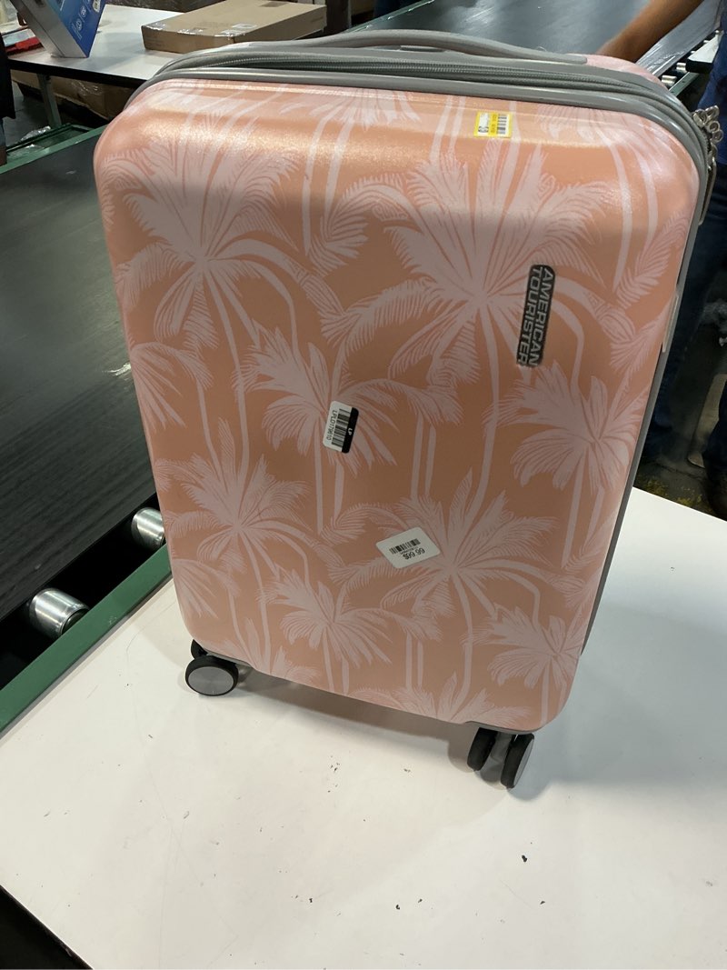 Condition photo showing As Is for american tourister modern hardside carry on spinner suitcase - coral palms: multicolored botanical 4-wheeler