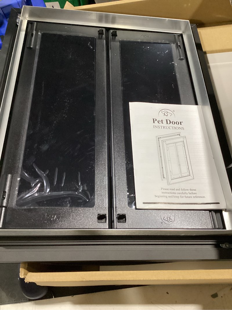 Condition photo showing Good Condition for aluminum large dog door for door mount, black french style heavy duty pet door, double magnetic flaps, telescoping tunnel, solid aluminum frame fits dogs up to 110 lb