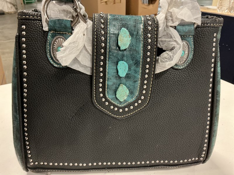 Condition photo showing Good Condition for black leather and steel women’s wallet