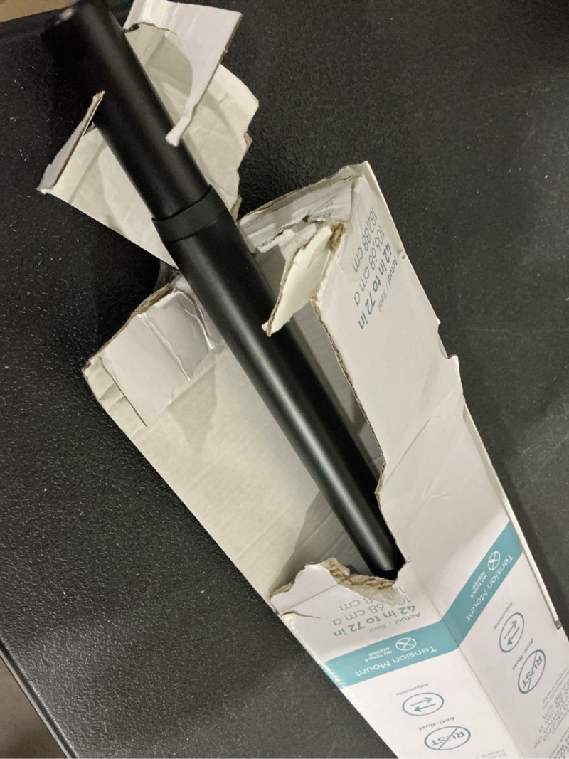 Condition photo showing As Is for origin 21 42-in to 72-in matte black tension single straight adjustable shower curtain rod