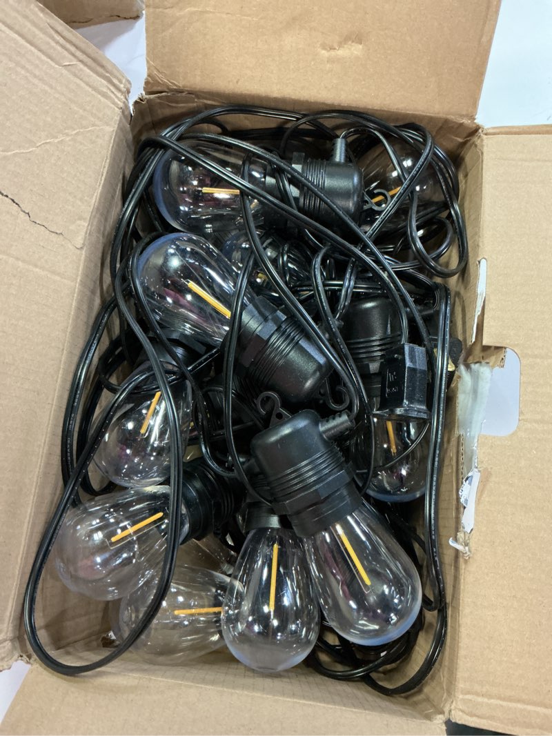 Condition photo showing Good Condition for 50ft led outdoor string lights with 16 shatterproof waterproof s14 replaceable bulbs(1 spare), 2700k commercial grade patio lights, outside hanging light for yard garden porch deck decor s14 yellow 50ft