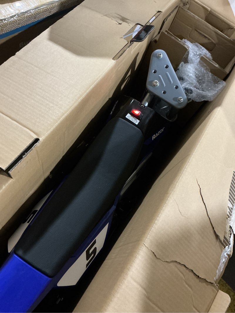 Condition photo showing Working Condition Verified for Razor MX350 Dirt Rocket Electric Bike for Kids Ages 8+, 140 lb Max Weight, Blue – 24V Battery, Up to 14 Mph, 30-Min Ride Time on High Speed, Twist-Grip Throttle, Spoked Wheels w/ 12” Pneumatic Tires