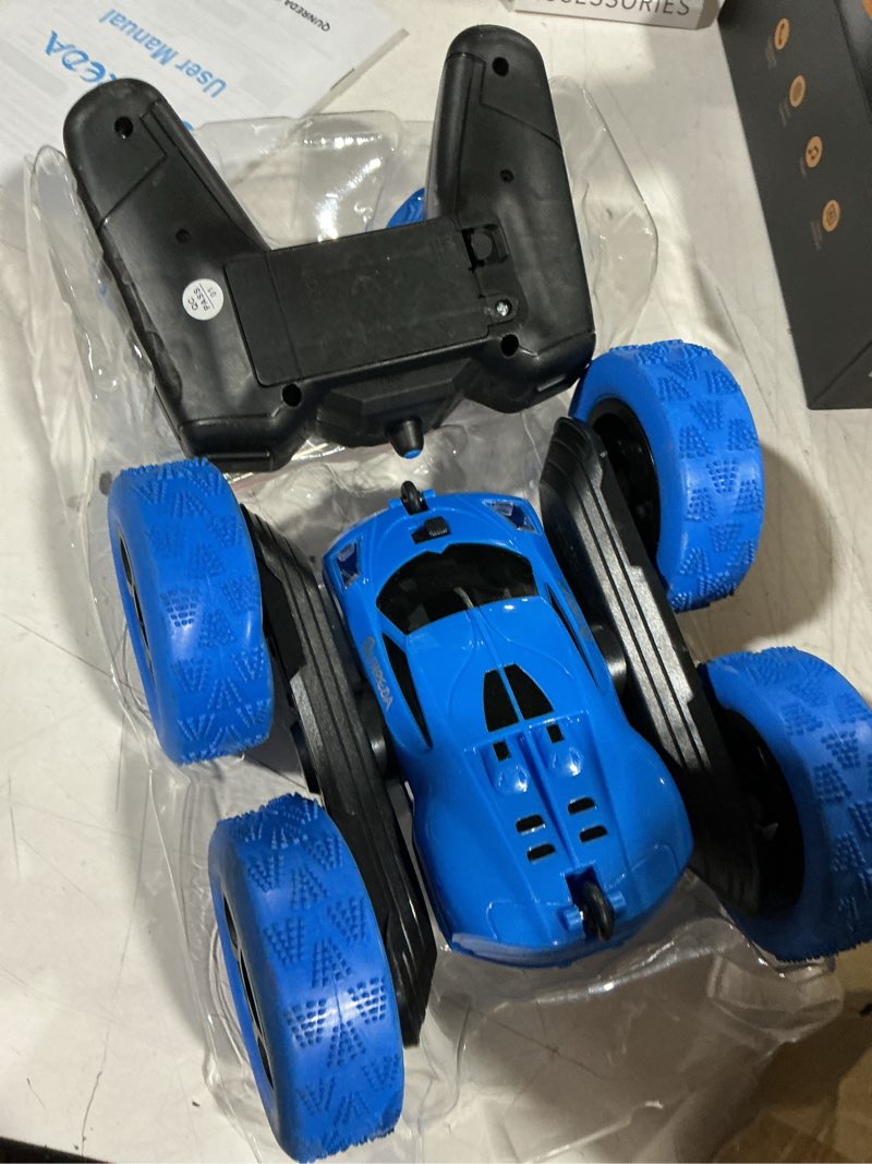 Condition photo showing As Is for qunreda remote control car, rc cars toys for kids ages 6-12, 4wd stunt car with led lights & 360° flips, 2.4ghz, upgraded usb-c modular batteries, 8-10 year old boys birthday gift 1-blue