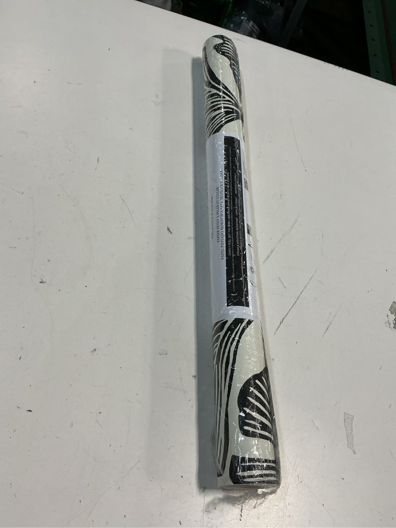 Condition photo showing New/Like New for Tempaper x Novogratz Zebra Black Feather Palm Removable Peel and Stick Wallpaper, 20.5 in X 16.5 ft, Made in The USA Zebra Black 20.5" x 198"