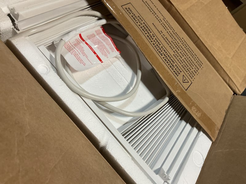 Condition photo showing As Is for amazon basics 5000-btu window air conditioner with quiet operation, up to 150 sqf, cool and fan functions, washable filter, adjustable window kit, intuitive mechanical controls, for small room, white white 5000 btu