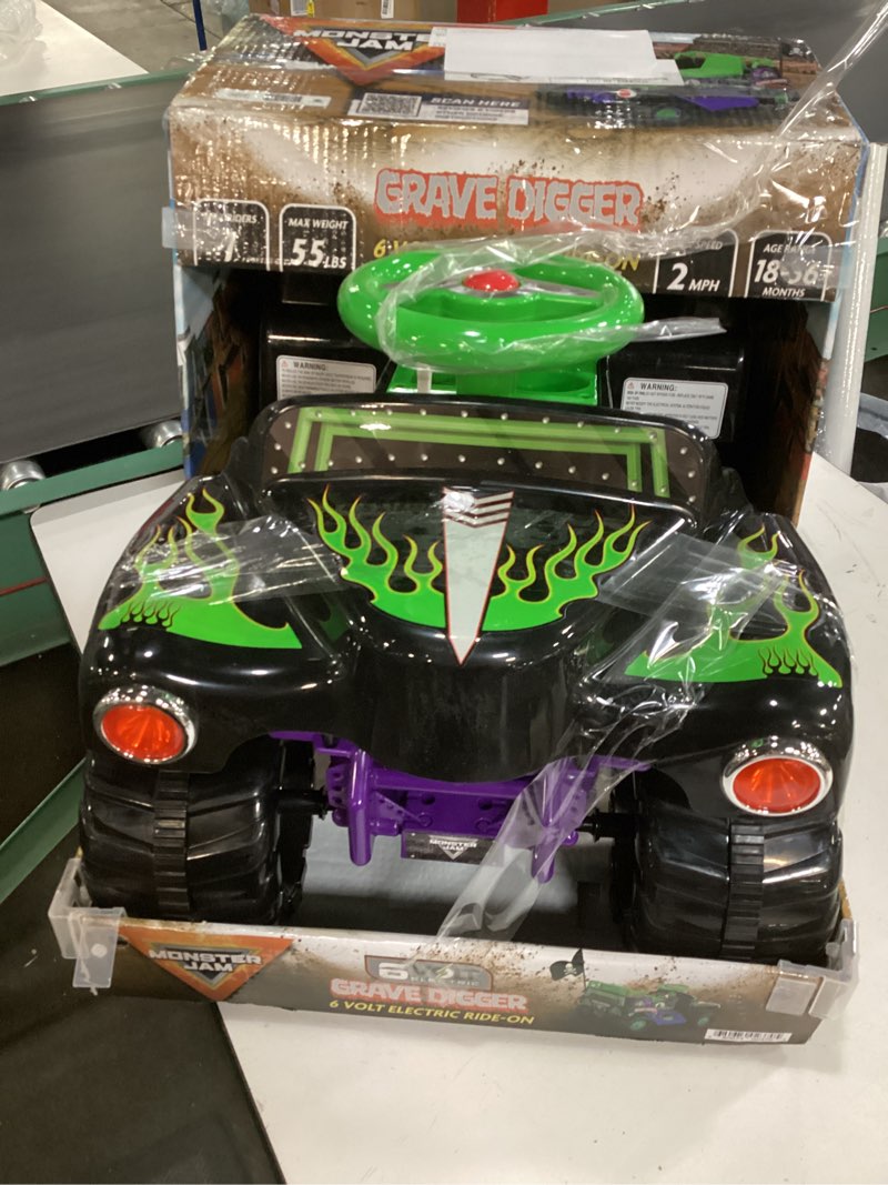 Condition photo showing As Is for 6 volt grave digger ride on car monster truck monster jam graphics for boys & girls 18-36 months
