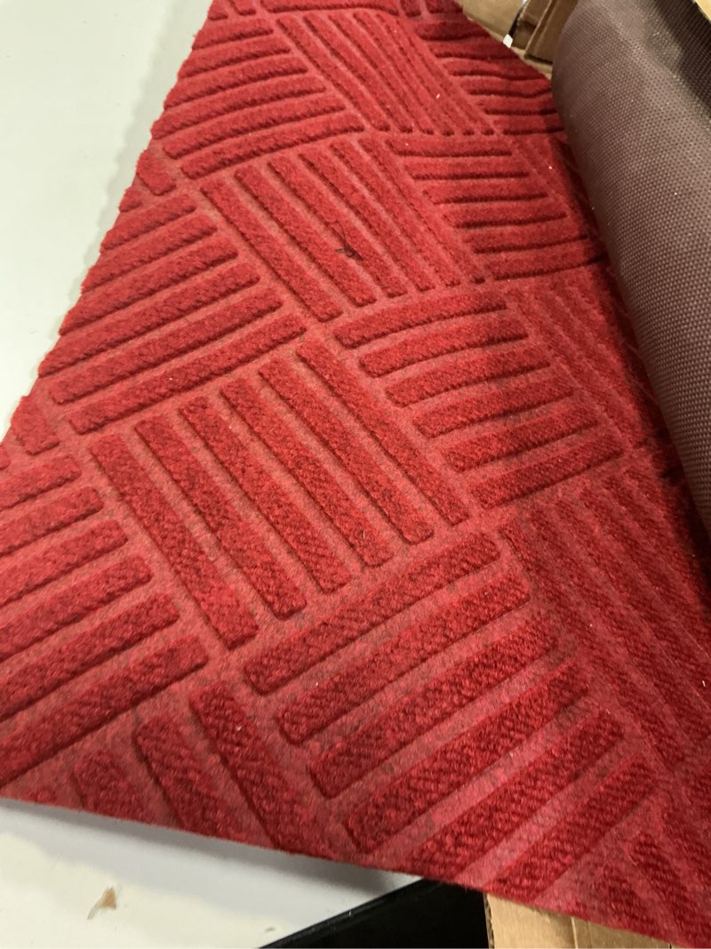 Condition photo showing As Is for Waterhog Fashion Smooth Back Red Black 4' x 8' Drainable Entrance Mats