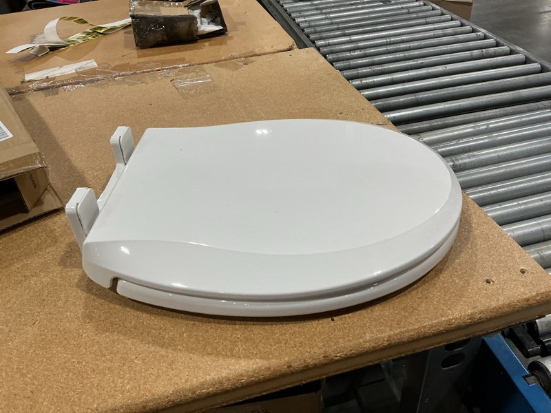 Condition photo showing New/Like New for toilet seat, round toilet seat with toddler seat built in, potty training toilet seat round fits both adult and child, with slow close and magnets- round