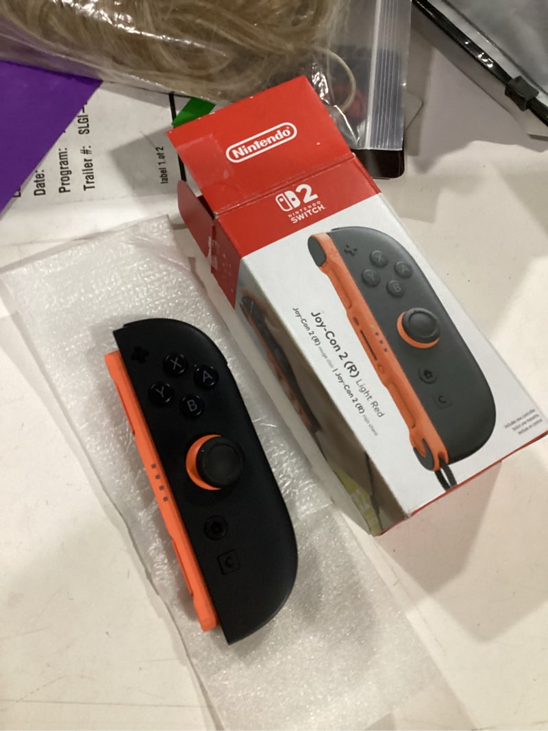 Condition photo showing New/Like New for nintendo joy-con™ 2 (r) light red light red joy-con 2 (r)