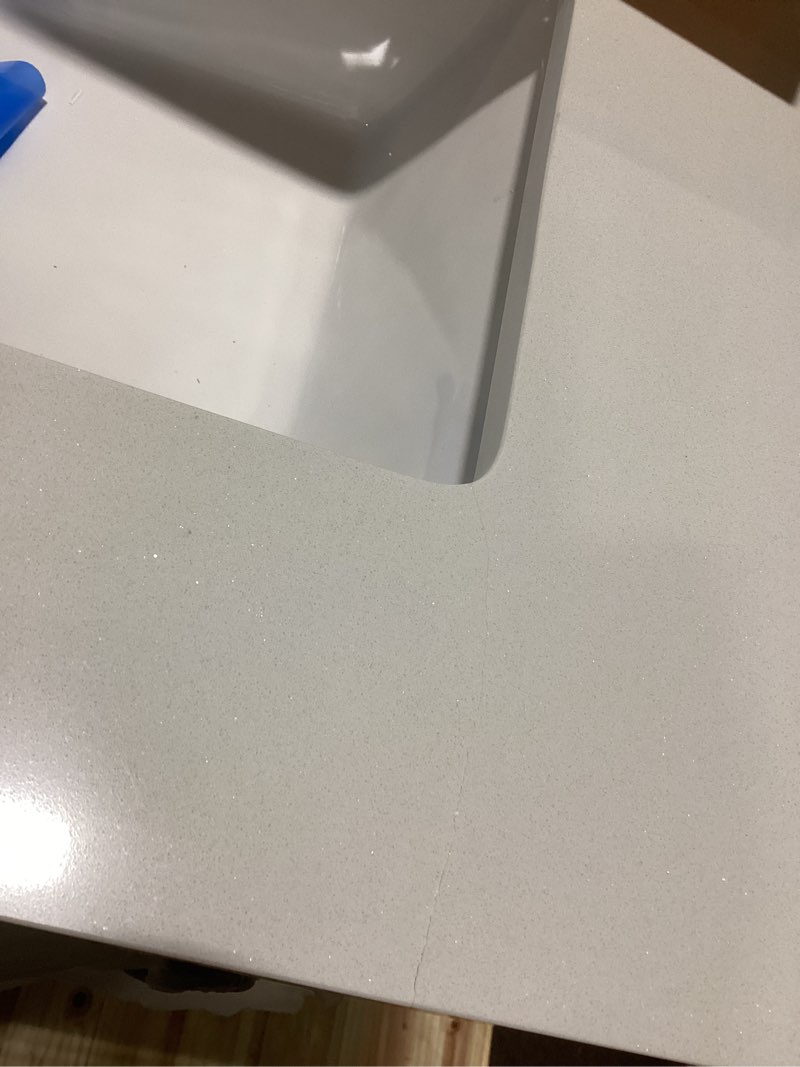 Condition photo showing As Is for allen + roth rigsby 30-in white undermount single sink bathroom vanity with white engineered marble top