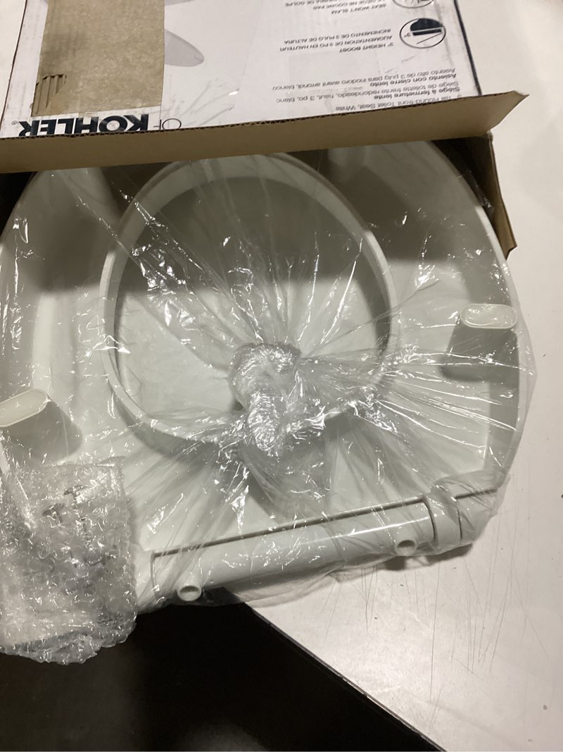 Condition photo showing New/Like New for KOHLER 25876-0 Hyten 3" Height, Elevated Soft Close Round Toilet Seat, Contoured Seat with Grip-Tight Bumpers, Quick-Attach Hardware, White White Round
