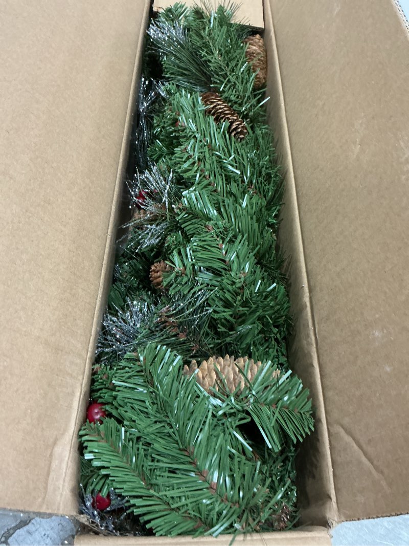 Condition photo showing Good Condition for National Tree Company 9 ft Pre-Lit Crestwood Spruce Artificial Christmas Garland, Christmas Decoration with Glitter, Pinecones, Red Berries, 50 Clear Lights, 180 Tips, Green Plug In Tree