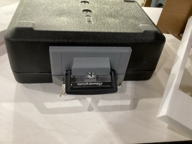 Condition photo showing New/Like New for SentrySafe Fireproof Safe Box with Key Lock, Chest Safe with Carrying Handle to Secure Money, Jewelry, Documents, 0.25 Cubic Feet, 6.3 x 15.3 x 12.1 Inches, 1160 Fire resistant box 0.25 cu. ft.