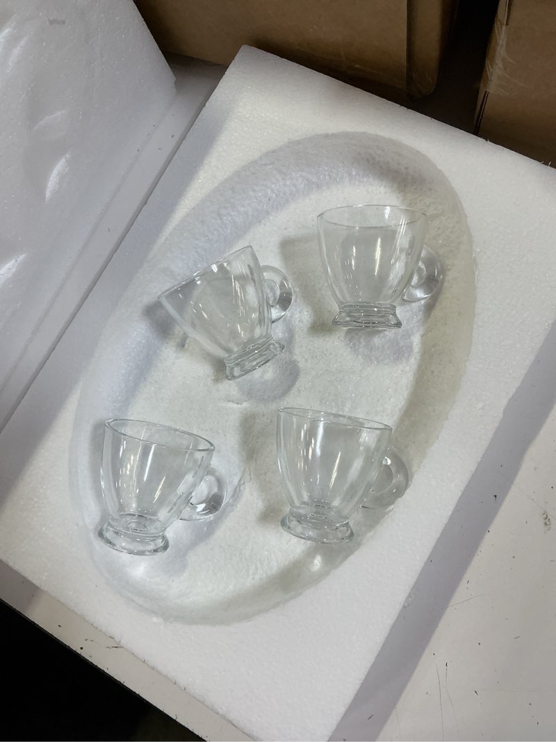 Condition photo showing Good Condition for set of 4 clear glass espresso mugs feature a classic, flared-rim design with a sturdy pedestal base and curved side handle, typically holding about 3 to 4 ounces